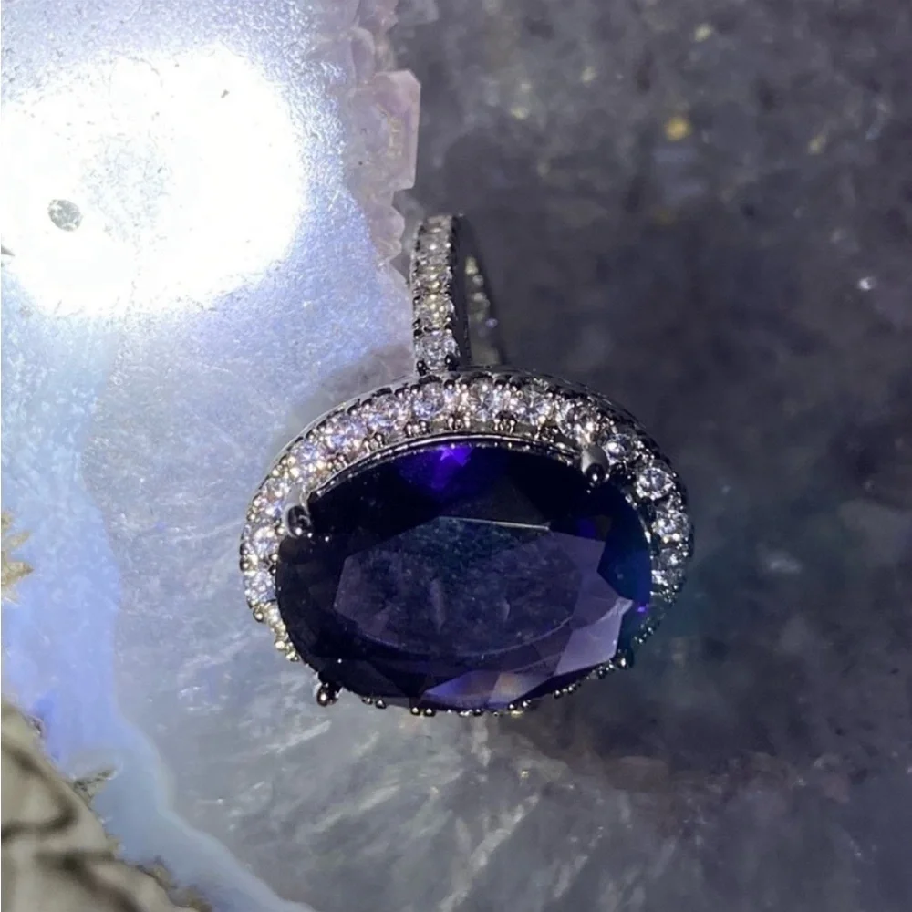 Sterling Silver amethyst prong set cocktail ring with gemstone halo bezel